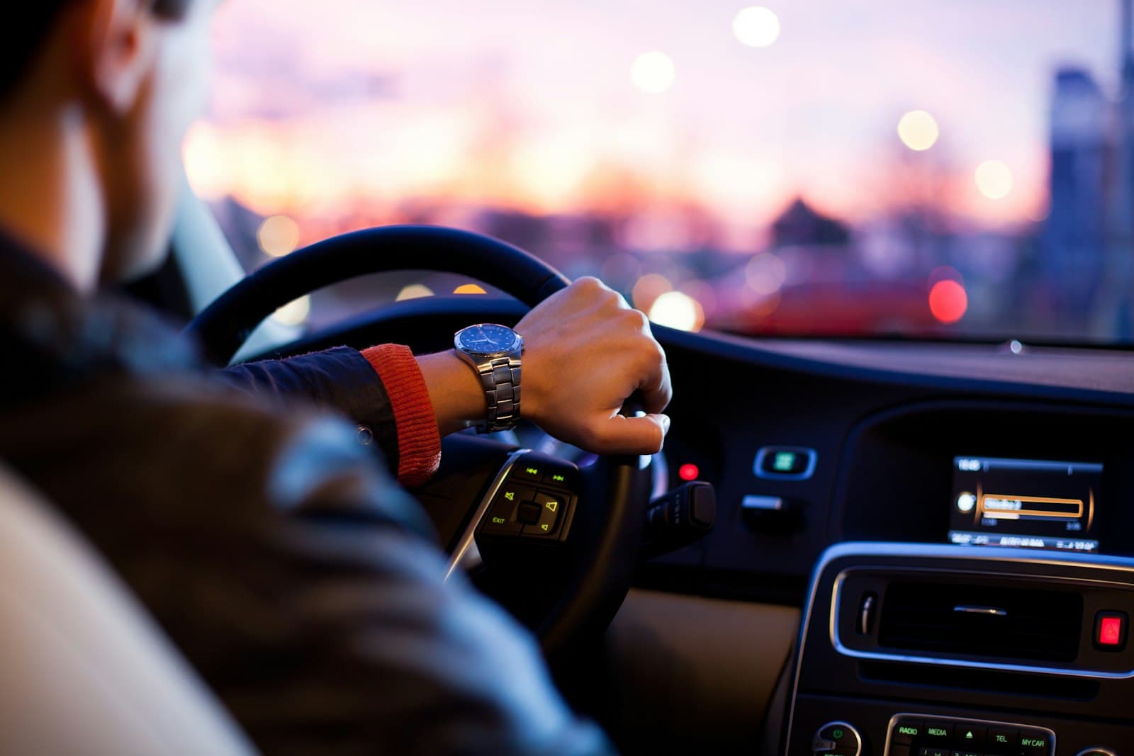 Driver on an evening commute for monthly UAE car lift plans